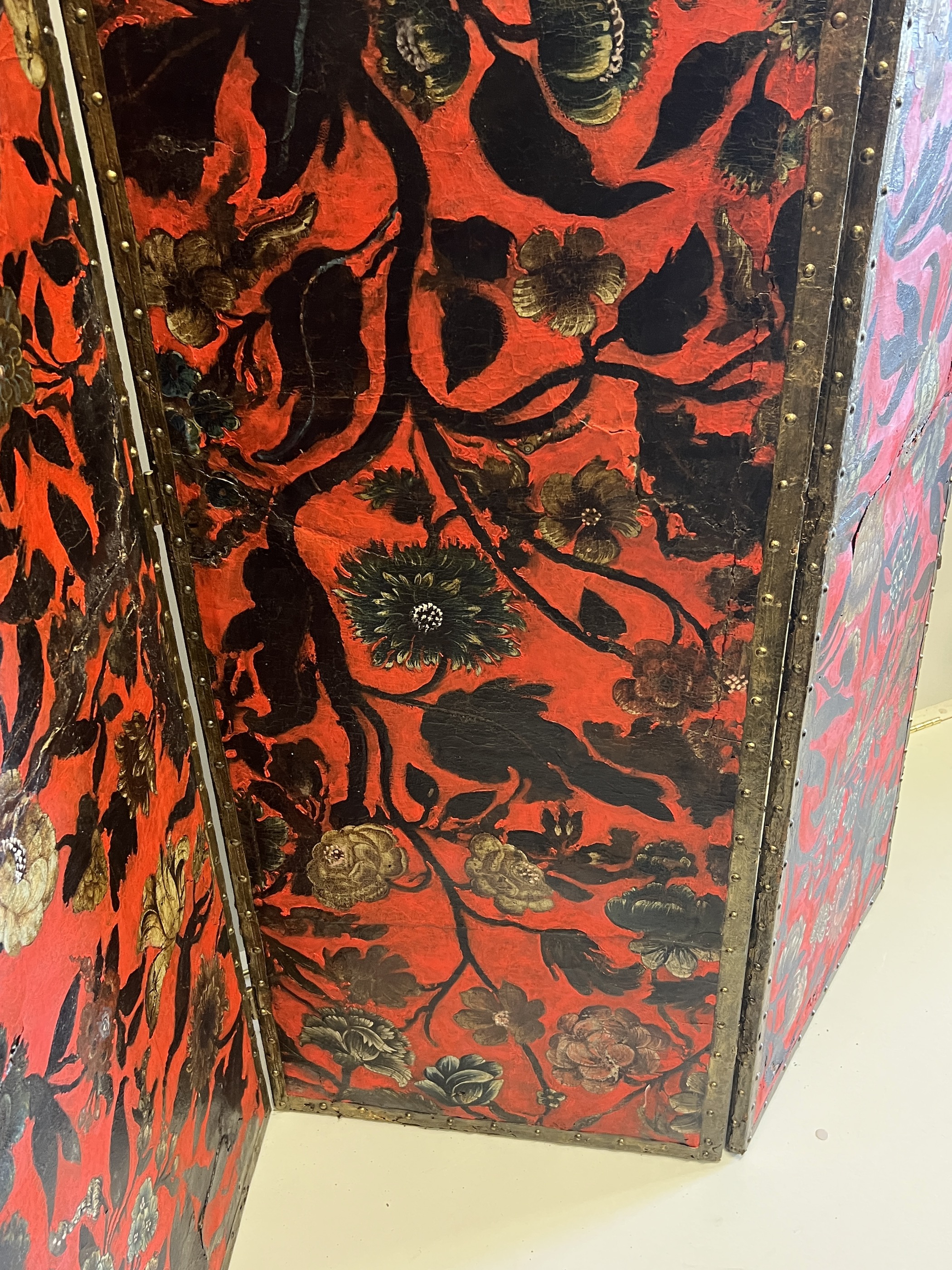 A 19th century Spanish leather three fold dressing screen re-painted by Ricardo Cinalli for the current owner, each panel width 57cm, height 175cm